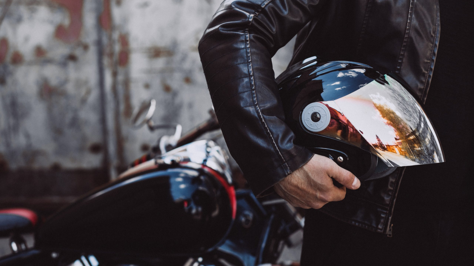 Handsome man biker travelling on mototrcycle